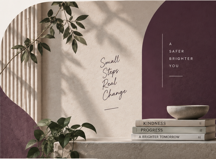 Sunlit wall with plants, plum arches and a stack of books titled Kindness, Progress, A Brighter Tomorrow